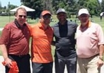 Orange and Black Ball Winner Golfs with Coach Stoudamire